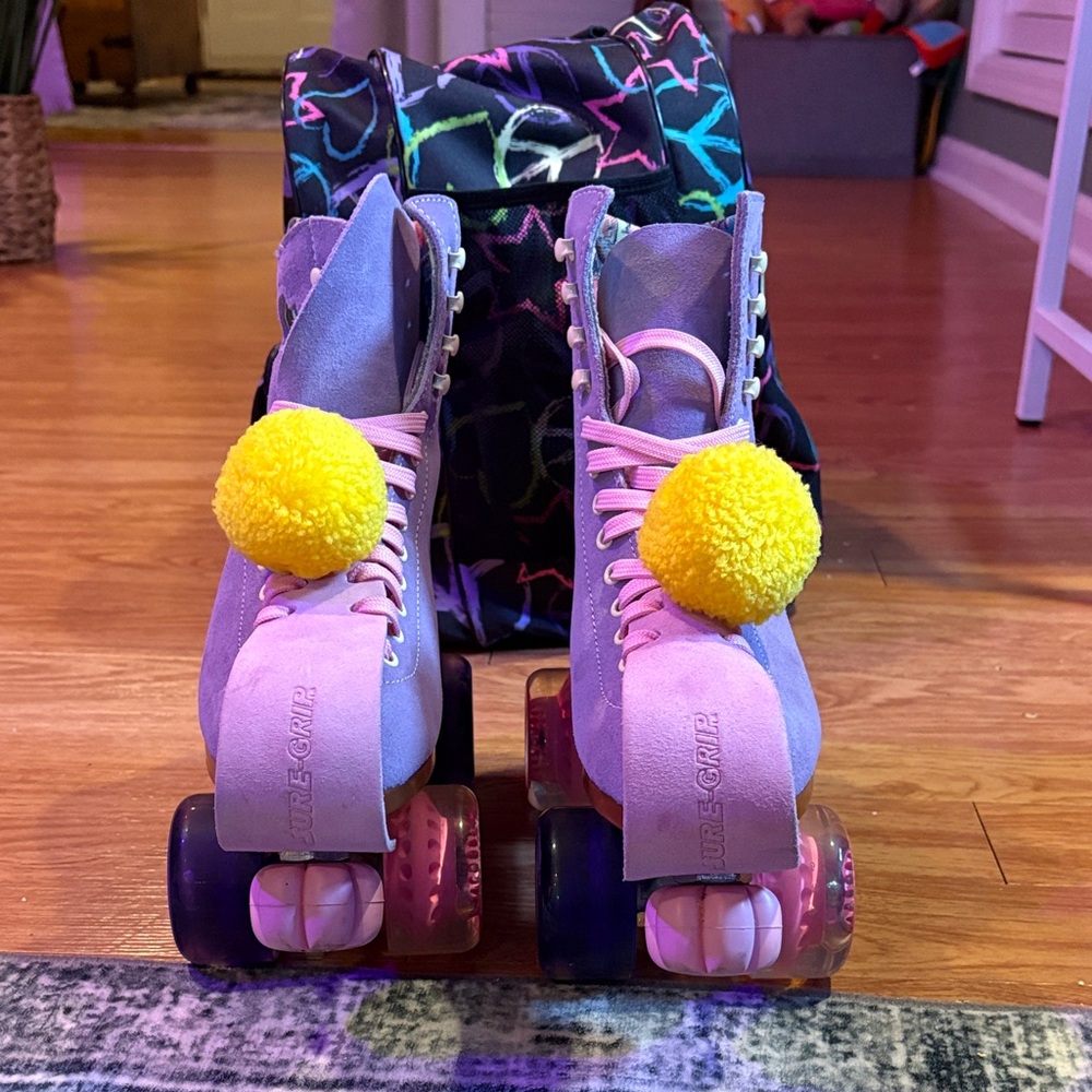 Purple Women's Quad Roller Skates with Yellow Pom-Poms